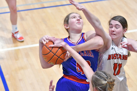 Emily Ackerson doesn’t get a lot of room to operate down low on offense in HPC’s 55-22 loss to Meridian in the CRC quarterfinals. 