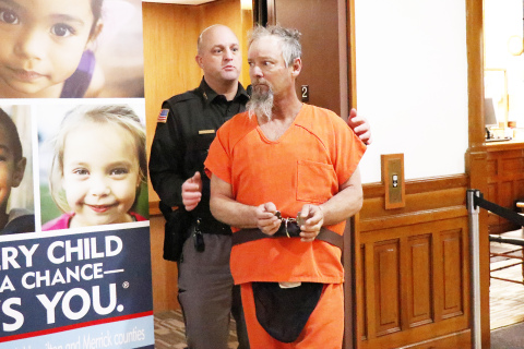 Hamilton County Sheriff Jeromy McCoy escorts murder suspect Jeffrey Adams into county court Tuesday morning.