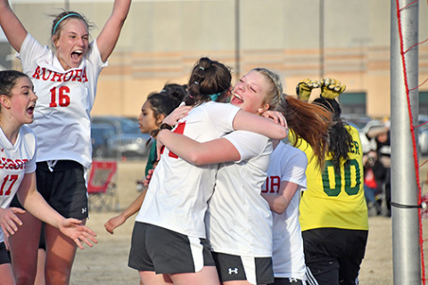 Aurora celebrates after its second goal during a 3-2 loss to Schuyler in the season-opener Monday evening. 