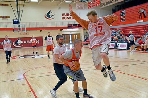 The Class of 2018’s Grant Moody waits patiently on the block as 2008-10’s Jarod Nitkiewicz goes flying by. For the second year in a row, the Class of 2018 won the Aurora alumni tournament.  