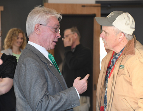 Dist. 34 Sen. Loren Lippincott, left, visits with Hamilton County Commissioner Francis McDonald after Friday’s legislative update in Aurora.