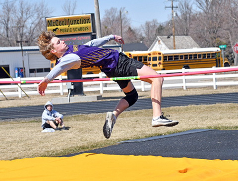 Hampton’s Brayden Dose twists his way over the bar in the high jump event at McCool Junction last week. Dose finished third in the event at 5-6. 
