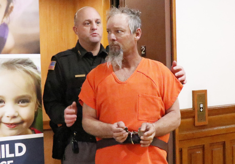 Hamilton County Sheriff Jeromy McCoy escorts murder suspect Jeffrey Adams into county court during a preliminary hearing, Feb. 28. Adams appeared in court Thursday via Zoom, pleading not guilty to the charge of second degree murder.