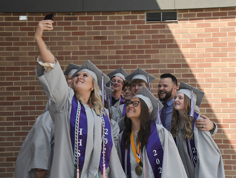Brooke Lubke does the honors, taking a photo of the Hampton Class of 2023.