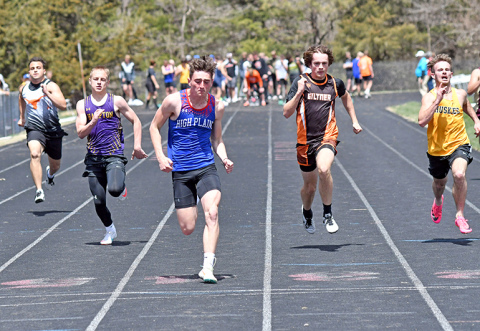 HPC’s Gavin Morris wins his 100 meter dash heat race at Saturday’s CRC meet at Osceola, flanked in either lane by Hampton’s Jack Bullis (left) and Giltner’s Blaydon White (right). Morris finished third in the 100 finals later in the afternoon. 