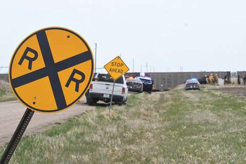 The Hamilton County Sheriff’s Department, Nebraska State Patrol and Phillips Fire and Rescue personnel are shown at the scene near a railroad crossing where a tractor collided with a train on Thursday afternoon. 