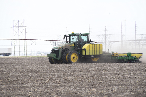 A farmer uses a tractor to plant seed last week near Highway 14 north of Aurora. Four farmers from Hamilton County reported dry climate, low soil temperature and high input prices for this year’s planting season.