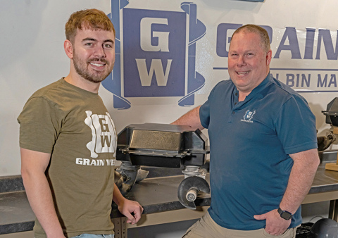 Grain Weevil co-founders, from left, Ben and Chad Johnson display the latest model of their autonomous robot that levels grain in bins and performs other tasks  to prevent grain bin deaths. The machines are currently being tested in commercial applications but the goal of the company is to make them available to family farmers by next year. 