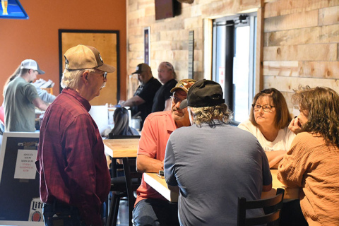 Customers enjoy the food and fellowship at the new Winchesters Saloon in Phillips. 