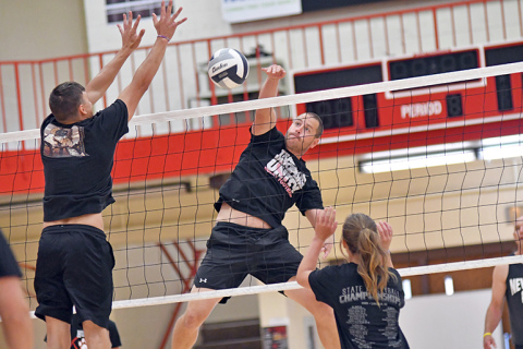 Aurora coach and teacher Madision Farris showed plenty of athleticism with a huge kill swing early in the day. 