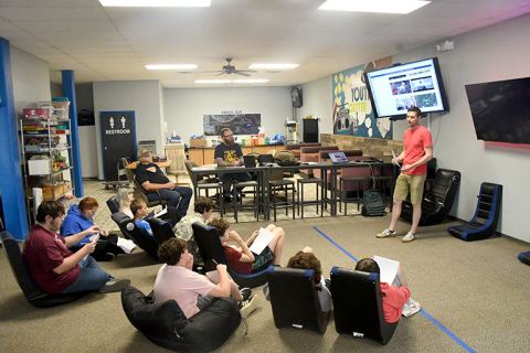 Volunteers teach a class of students at the Hamilton County Youth Center about videography via the Videography Club course in partnership with Beyond School Bells.