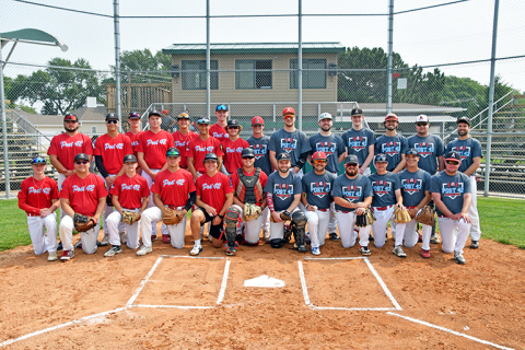 Members of the Aurora Post 42 Pinnacle Bank Seniors pose with Legion alumni Saturday at Mitchell Field.