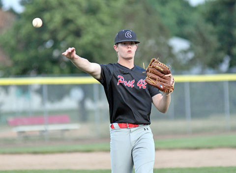 Layton Hohm fires over to first base for an out during Aurora’s game with PWG June 27. 