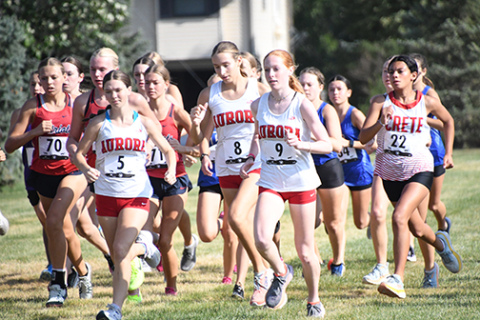 Aurora runners, from left, Ella Eggleston, Jordyn Slagle and Kendal Wineteer charge out of the gates during Thursday’s Seward Invite. 