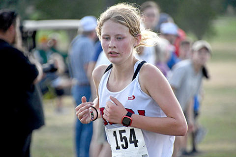 Aurora’s Kailey Dick earned her first medal of the season at Central City, finishing 14th with a new personal record time of 21:52.