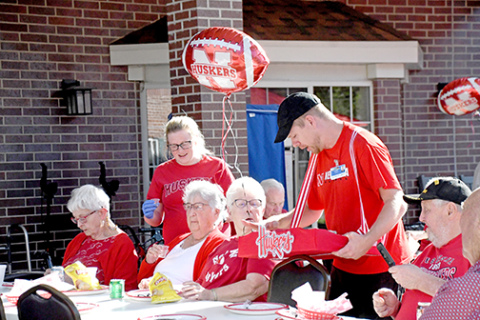 Hot dog anyone? East Park Villa residents enjoyed the whole pre-game experience Thursday, with staff members acting as vendors at Memorial Stadium.