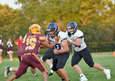 Hampton's Korbin Stump sets the lead block for the Hawk run game in a 35-34 thriller over Sterling. 