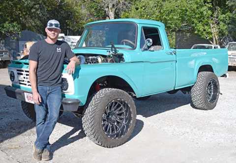 Dalton Hettle poses with his Caribbean turqoise 1964 pickup, a vehicle he has basically rebuilt from the ground up.
