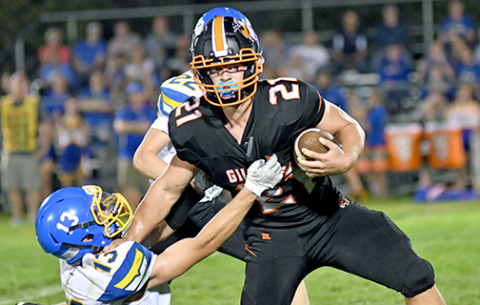 Jayden Smith (21) was a downhill runner for the Hornets all night long, totaling 119 yards on 20 carries and a touchdown. Smith is shown here during a fourth quarter run stiff arming a defender. 