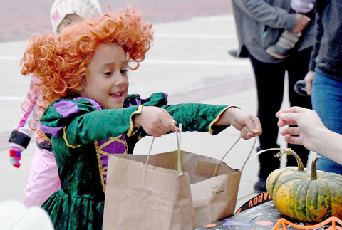 Little Winnifred, Kai Leichleiter-Moe, was excited to trick or treat around the square with her friends and family.