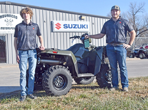 Caden (left) and Karson Meyer show off one of the many new Suzuki ATV products available at Advanced Motorsports, now located at the Highway 34/14 intersection in Aurora. 