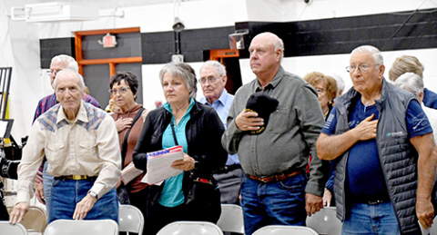 Concluding Giltner’s Veterans Day, the veterans and their spouses stood at attention for the playing of taps.