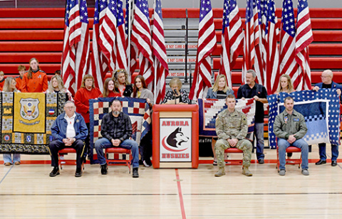 Four Hamilton County veterans await their award of Quilts of Valor at the Aurora High School Veterans Day program on Friday. 