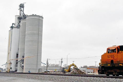 A track hoe begins dirt work on the site of the new CVA whole corn cleaning plant in Hampton. The facility will be attached to the existing silos , above, along Highway 34 and will be dedicated completely to food grade corn. 