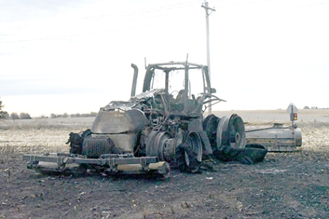 These are the charred remains of a Case tractor that was destroyed by fire Thursday on a field northeast of Aurora.