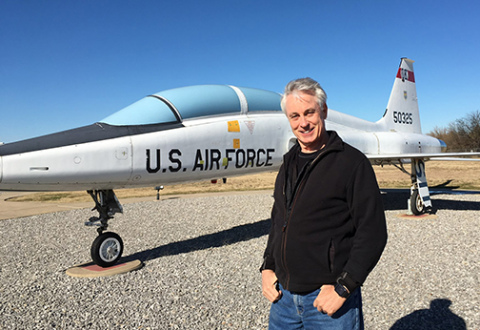 Sen. Loren Lippincott stands in front of a T38 fighter pilot training jet on display. During his days as a U.S. Air Force Top Gun he flew T38s in pilot training and fighter lead in training. 