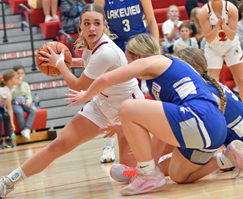 Denae Nachtigal scraps for an extra offensive possession during Aurora’s 32-26 victory over Lakeview Friday. Nachtigal tallied 17 points in the win. 