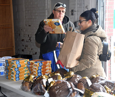 Darrell Schmidt was one of many volunteers helping with this year’s Hamilton County Food Pantry holiday distribution.
