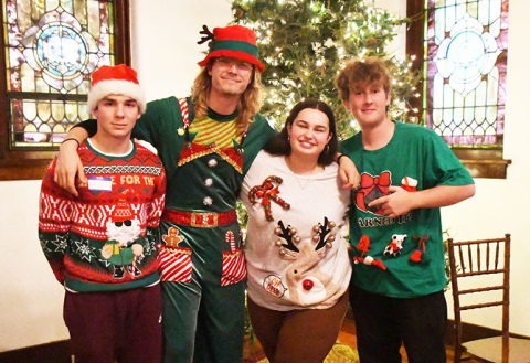 Displaying their ugly Christmas sweaters for Education First’s Christmas party were from left: Noham Borie (France), Jitse Valkenburg (Netherlands), Emma Heckmann (Germany) and Nils Lendi (Switzerland).