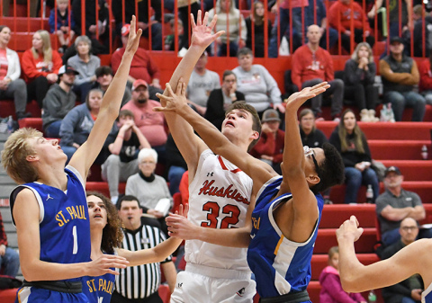 Ethan Ramaekers goes up strong for a shot inside during Aurora’s 60-28 win over St. Paul Thursday. Ramaekers paced the Huskies with 16 points in the game.