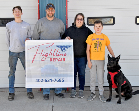 From left, Tyson Kottwitz, Leland, Angie and Reis Stump alongside their dog shadow.