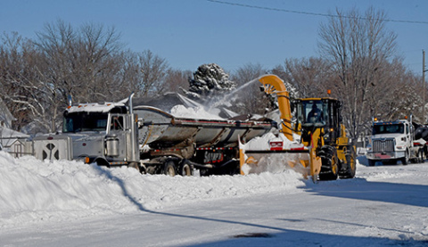 City crews remove snow in downtown Aurora.