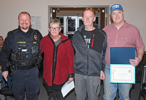 Pictured from left are Aurora Police Sgt. Nate Friesen, Rose and Bruce Larson, and Carlin Engert. Friesen and Engert received Life Saver Award certificates from the city after administering CPR to help save Bruce Larson’s life on May 28, 2023.