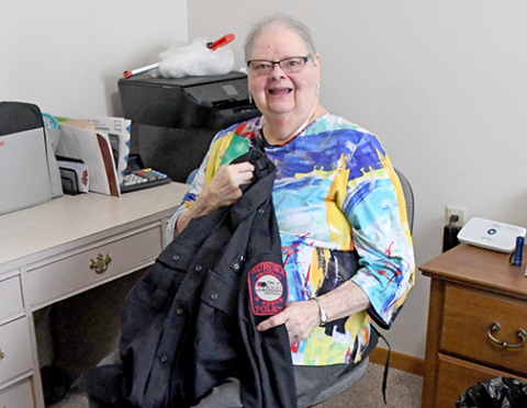 Now living at East Park Villa, former senior center director Barbara Graham now helps the Aurora Police Department by sewing on police patches and repairing uniforms.