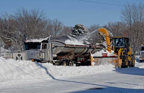 City crews remove snow in downtown Aurora.