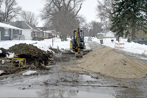 This was the scene at 2nd and G Streets in Hampton last Tuesday afternoon after workers repaired a water main break at that intersection. Village water users have been under a boil order for a week since the entire water system had to be shut down to make the repair. 