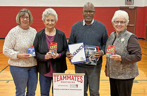 Polk United Methodist Church members brought new games and cornhole sets for mentors and their mentees to play with. From left, Audrey Samuelson, Sharon Johnson, Pastor Duncan Ibuuri and Karen Stevens.