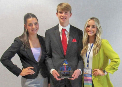 Nebraska FBLA President Graham Christenson (center) teamed with former Aurora FBLA secretary, Aleah Vinkenburg (left) and former chapter president, Kylie Svoboda, placed ninth in social media strategies at the National Leadership Conference of FBLA last July.