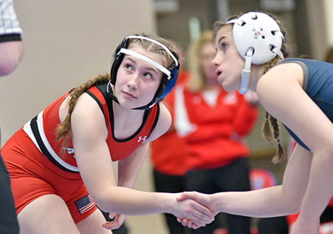 Paityn Wyatt shakes hands with her opponent prior to the start of the match. Wyatt was unable to reach the top four spots at Saturday’s 3A subdistrict, ending her season with a 23-12 record. 