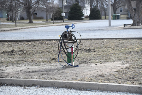 The well head for the Village of Hampton’s newly dug test well sits in a grassy area between the parking lots at the ball park on the west side of town. Water from the well tested at over 15 for nitrates so it cannot be used for drinking water. 