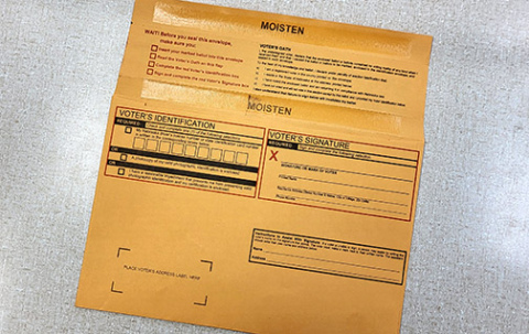 Voters used to mailing in their ballots will notice there’s a new look to the official envelopes this year. The new manilla envelopes provided by the Secretary of State are smaller so the ballots must first be folded before inserting in the envelope. 