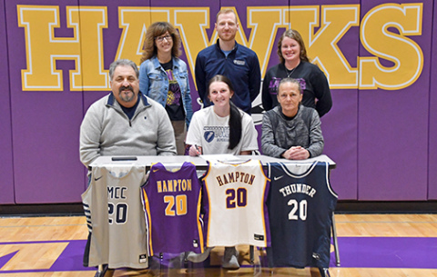 Hampton’s Neveah Lukassen will continue her education and basketball career at Manhattan Christian College. She signed March 22 with her family, Heaven Hall and Randy Maahs as well as Hawk coaches Margo LaBrie and Teya Mason with new MCC coach Dalton Miller.  