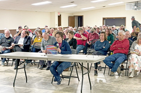 Tina Oswald testifies against granting a conditional use permit to Synergen Green Energy at a county Joint Planning and Zoning Commission hearing on March 19. 