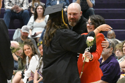 Hampton senior Shae Kingery shares a hug with her parents Beau and Denise. 