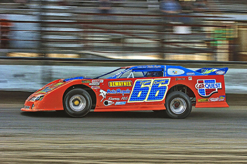 Jerry Jacobs stops a moment in time, photographing a late model car racing at Mid-Nebraska Speedway in Doniphan.