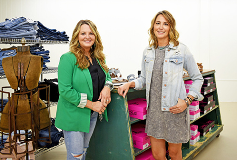 Old Homestead owners Robin Sanderson (left) and Jennie Snoberger showcase some of the styles they will have in their new store. The two are planning a soft opening for Homestead Style during A’ROR’N Days.